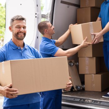Truck Movers Loading Van Carrying Boxes And Moving House